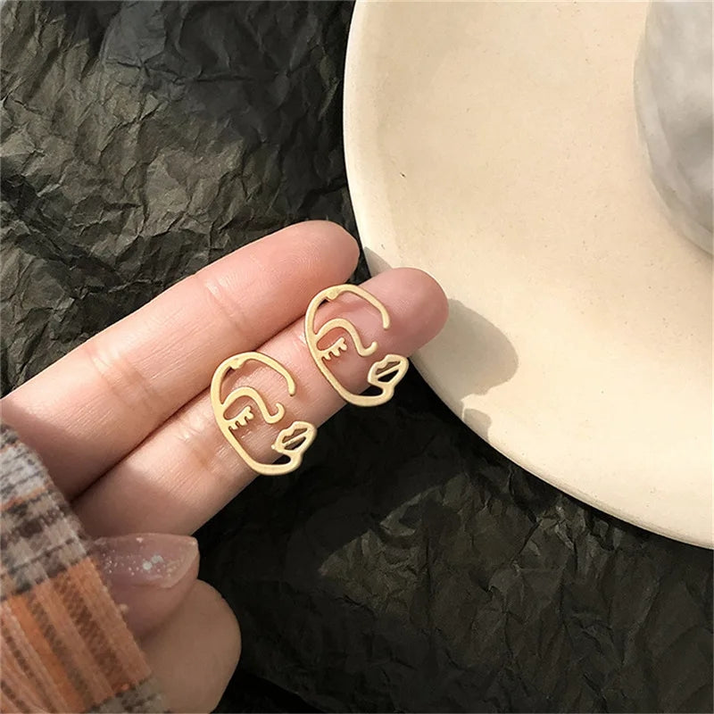 Tiny Muse Face Earrings